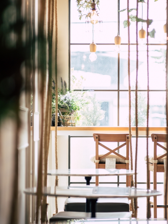 Coffee shop window with pretty aesthetic and seating